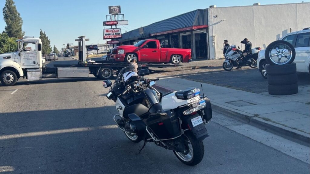 Fresno police cited a driver for reckless driving and misdemeanor child endangerment after officers said he was caught doing burnouts in a pickup truck carrying a woman and a 1-year-old child. (Fresno PD)