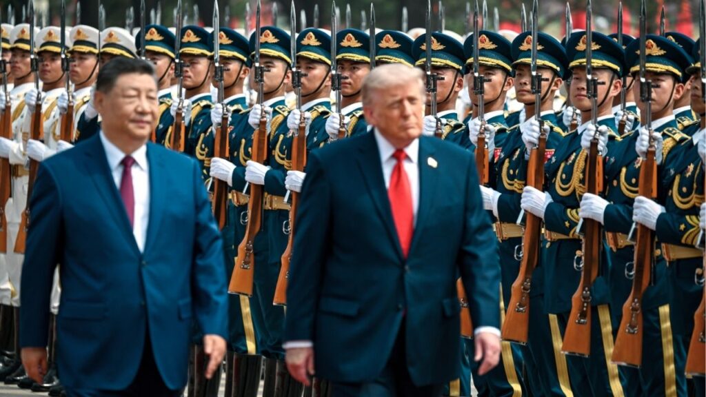 From left, President Xi Jinping of China and President Donald Trump review the military honor guard at the Great Hall of the People in Beijing on Tursday, May 14, 2026. Oil prices jumped on Friday, May 15, 2026, and stocks tumbled as the markets contended with persistent supply disruptions in the Middle East and the absence of meaningful breakthroughs at the summit meeting in Beijing. (Kenny Holston/The New York Times)