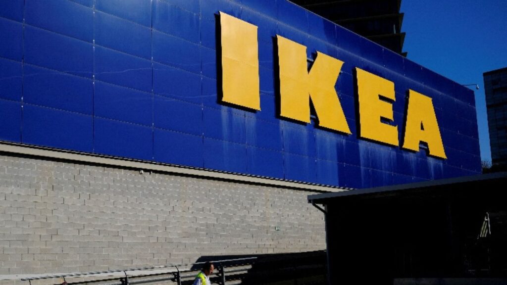 A worker walks past a logo of IKEA on the facade of an IKEA store in Barcelona, Spain April 26, 2024. (REUTERS/Nacho Doce/File Photo)