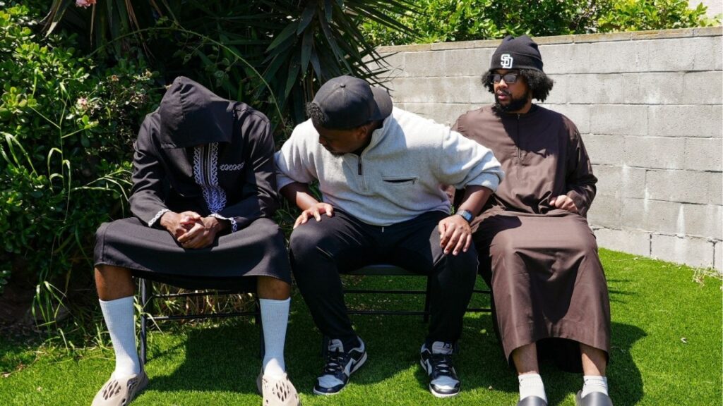 Jibril Abdullah, Mohammed Abdullah and Khalid Abdullah, sons of security guard Amin Abdullah, who was killed in a shooting incident, sit outside their home in San Diego, California, U.S., May 20, 2026. REUTERS/Arafat Barbakh