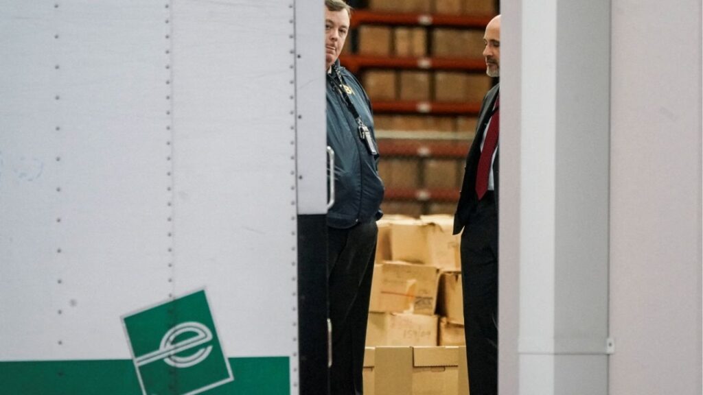 Members of the Federal Bureau of Investigation (FBI) stand inside a vehicle loaded with boxes outside the Fulton County Election Hub and Operation Center after the FBI executed a search warrant there in relation to the 2020 election, according to a law enforcement official familiar with the matter, in Union City, Georgia, U.S. January 28, 2026. (Reuters File)