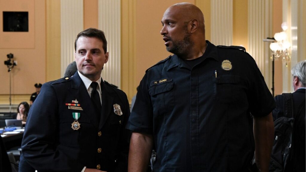 Officer Daniel Hodges of Washington’s Metropolitan Police, left, and Harry Dunn, then an officer with the U.S. Capitol Police, at a congressional hearing at the Capitol in Washington, June 16, 2022. Two police officers who defended the Capitol against a pro-Trump mob on Jan. 6, 2021, sued the Trump administration on Wednesday, May 20, 2026, to try to block the creation of a nearly $1.8 billion fund that they say will be used to reward the rioters and right-wing militia groups who tried to stop Congress from certifying the election results that day.(Kenny Holston/The New York Times)