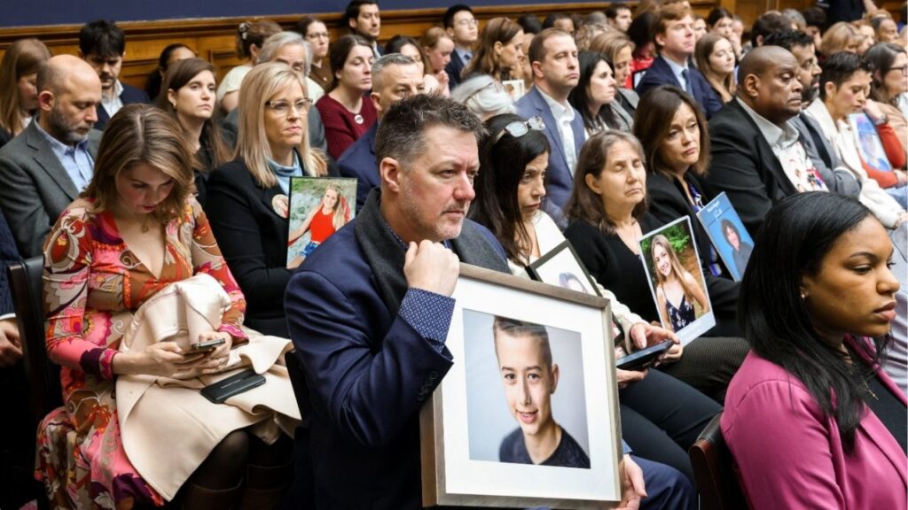 Parents hold images of their children, who were harmed by social media, during a House Energy and Commerce Committee markup of nine bills, including the Kids Internet and Digital Safety (KIDS) Act, on Capitol Hill in Washington, D.C., U.S., March 5, 2026. (Reuters/Kylie Cooper)