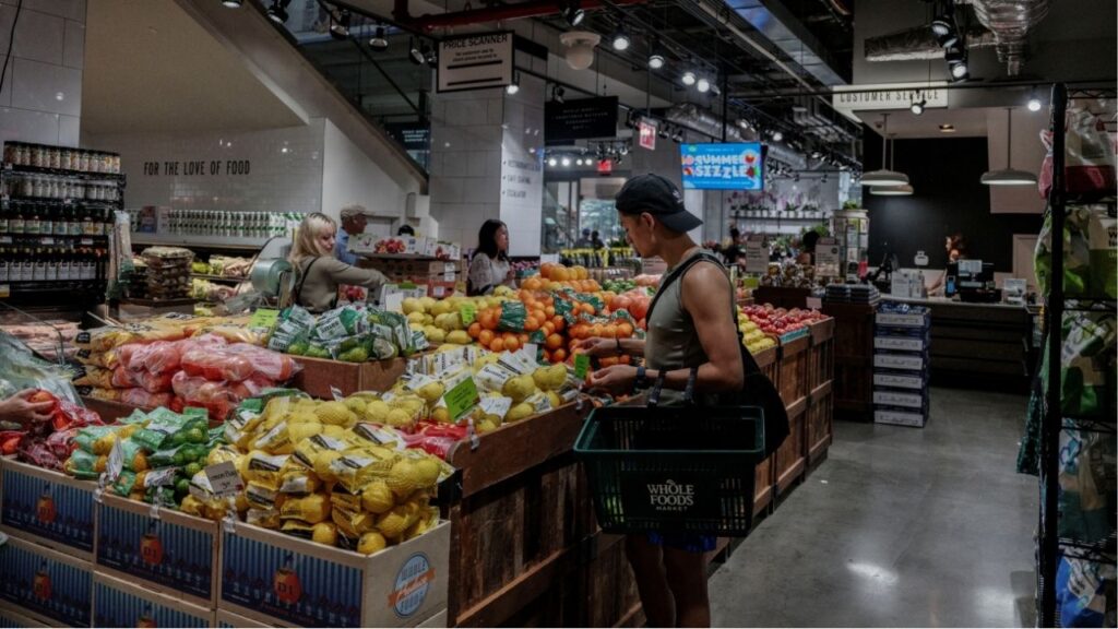 People shop for groceries at a store in New York City, U.S., July 15, 2025. (Reuters/Jeenah Moon)