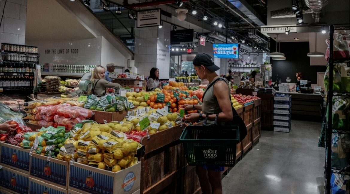 People shop for groceries at a store in New York City, U.S., July 15, 2025. (Reuters/Jeenah Moon)