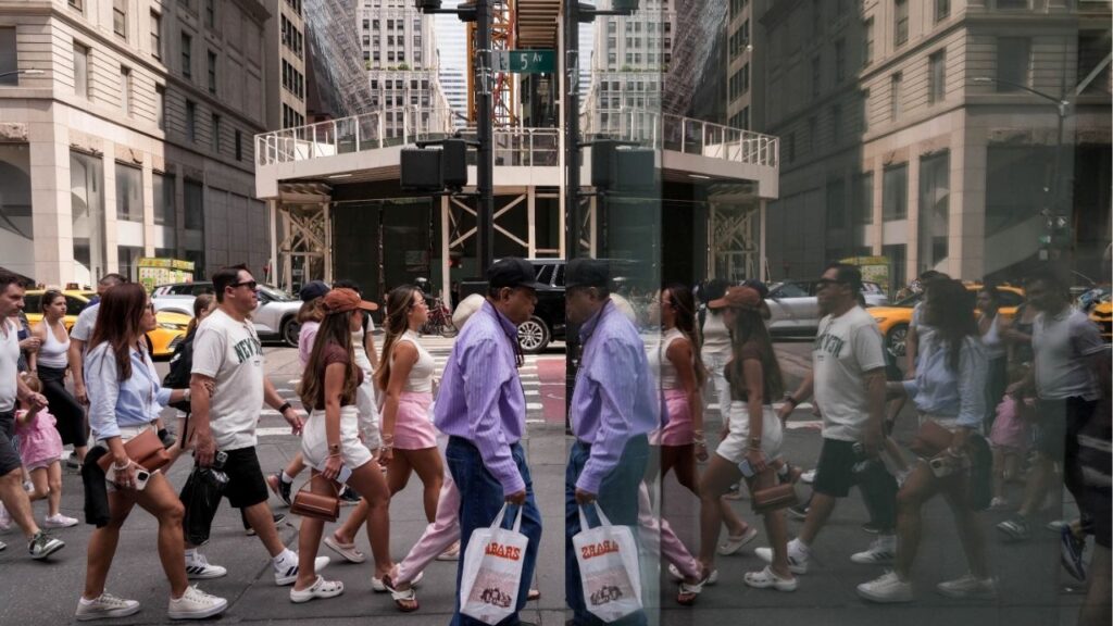 People walk on Fifth Avenue, in New York City, U.S., August 7, 2025. (Reuters/Adam Gray)