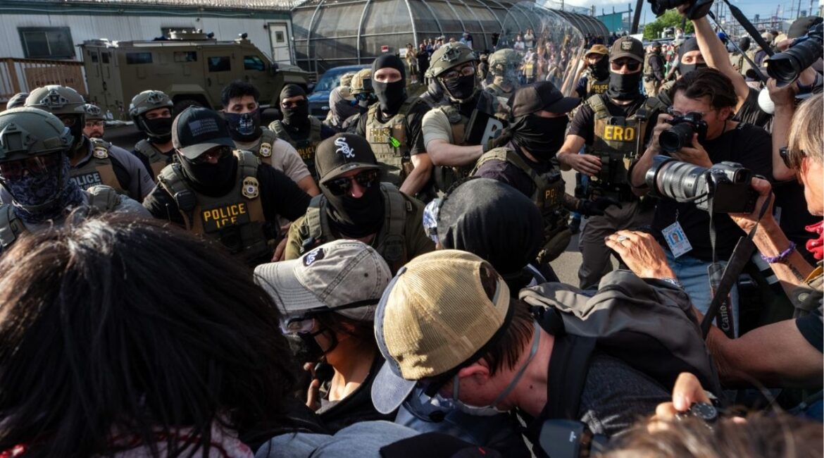 Protesters scuffle with masked immigration agents during a demonstration outside Delaney Hall, an immigration detention center in Newark, N.J., on Thursday evening, May 28, 2026. For nearly a week, relatives of migrants at Delaney Hall have said that some detainees have been on a hunger strike at the facility. Federal officials have denied that a hunger strike is taking place. (Todd Heisler/The New York Times)