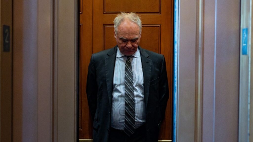Sen. Tim Kaine (D-Va.) boards an elevator after leaving a vote on the Senate floor to halt the war in Iran at the Capitol in Washington, on Wednesday, May 13, 2026. The effort failed on a vote of 50 to 49, with Sen. John Fetterman (D-Pa.) again joining Republicans in opposition. Kaine said there was no threat of “any action anytime soon by Iran” to develop nuclear weapons that justified a wide-scale military operation. (Tierney L. Cross/The New York Times)