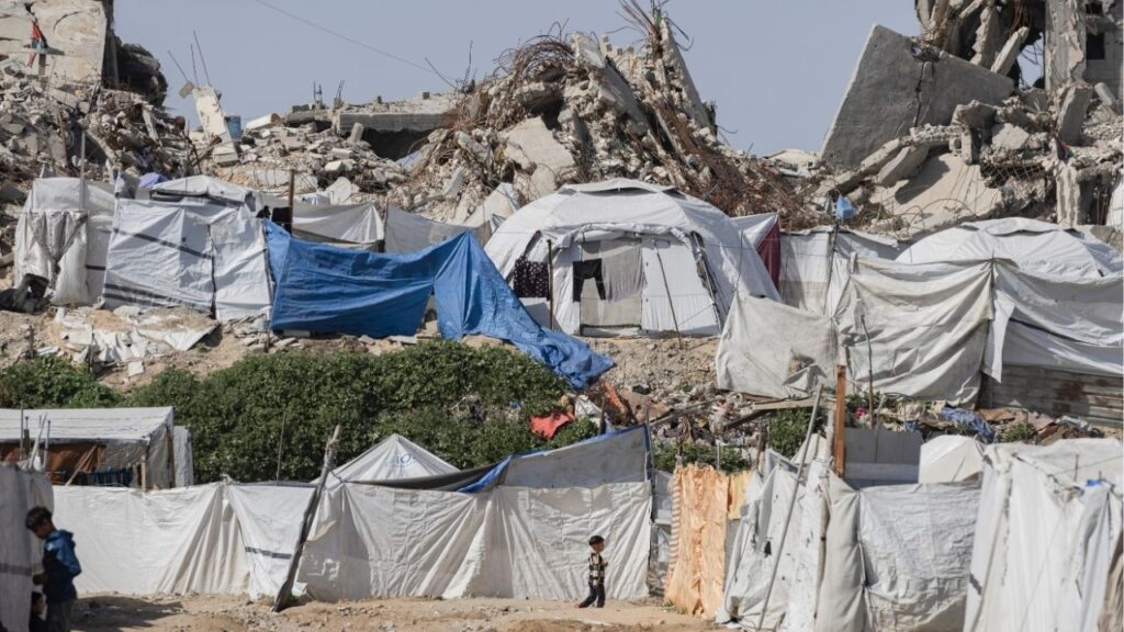 Tents of displaced Palestinians among the rubble of buildings in the Zeitoun neighborhood east of Gaza City, Feb. 12, 2026. President Trump’s proposal to end the war with Iran would delay tackling the most contentious issues — a tactic that has had mixed results in Gaza. (Saher Alghorra/The New York Times)