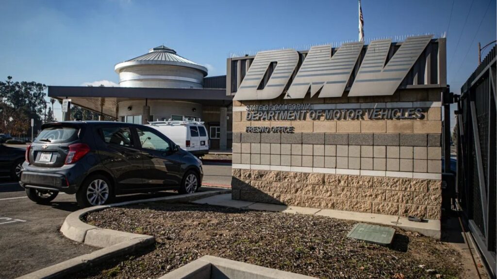 The DMV has asked for $55 million to share its driver license data to a national organization. Advocates say the move could endanger unauthorized immigrants. Department of Motor Vehicles parking lot in central Fresno on Dec. 13, 2022. Photo by Larry Valenzuela for CalMatters
