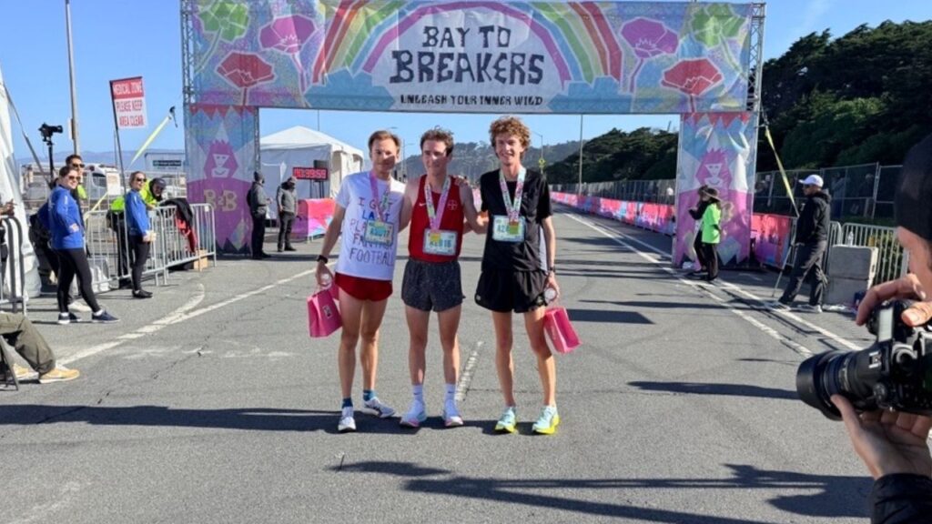 The mens top 3 finishers, with the winner Noaln Hosbein (center), at the finish line at Bay to Breakers on May 17, 2026. (Anthony W. Haddad)