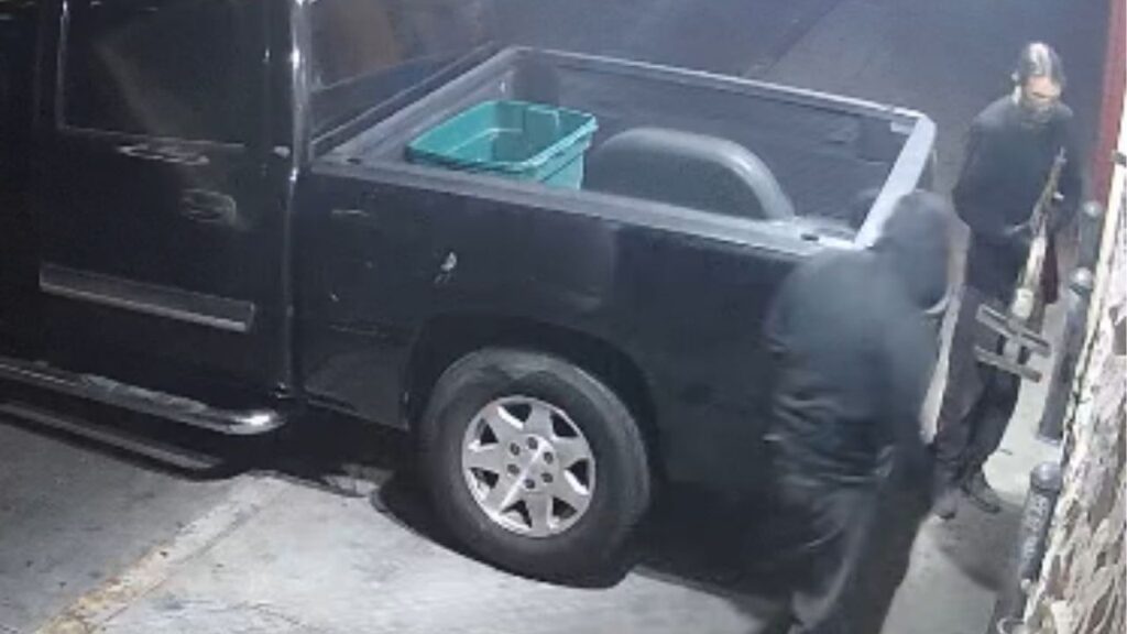 The suspects use a homemade tool to attach to their truck to the security gate at the Fresno break-in on May 25, 2026. (Screengrab)