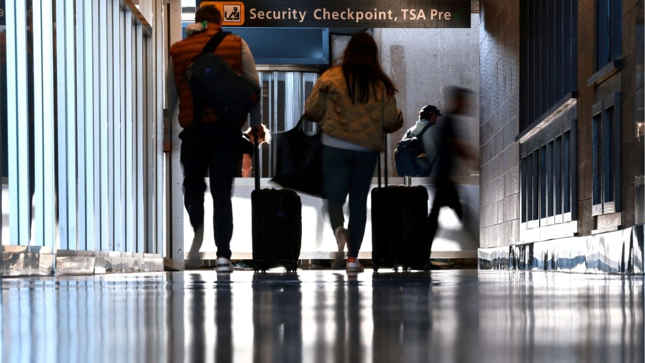 Travelers wait to pass a security checkpoint at Dulles International airport in Dulles, Virginia, U.S. November 13, 2025. (Reuters File)