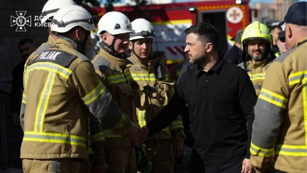 Ukraine's President Volodymyr Zelenskiy meets with rescuers at the site of an apartment building damaged during yesterday's Russian missile and drone strike, amid Russia's attack on Ukraine, in Kyiv, Ukraine in this handout picture released May 15, 2026. Press service of the State Emergency Service of Ukraine in Kyiv/Handout via REUTERS