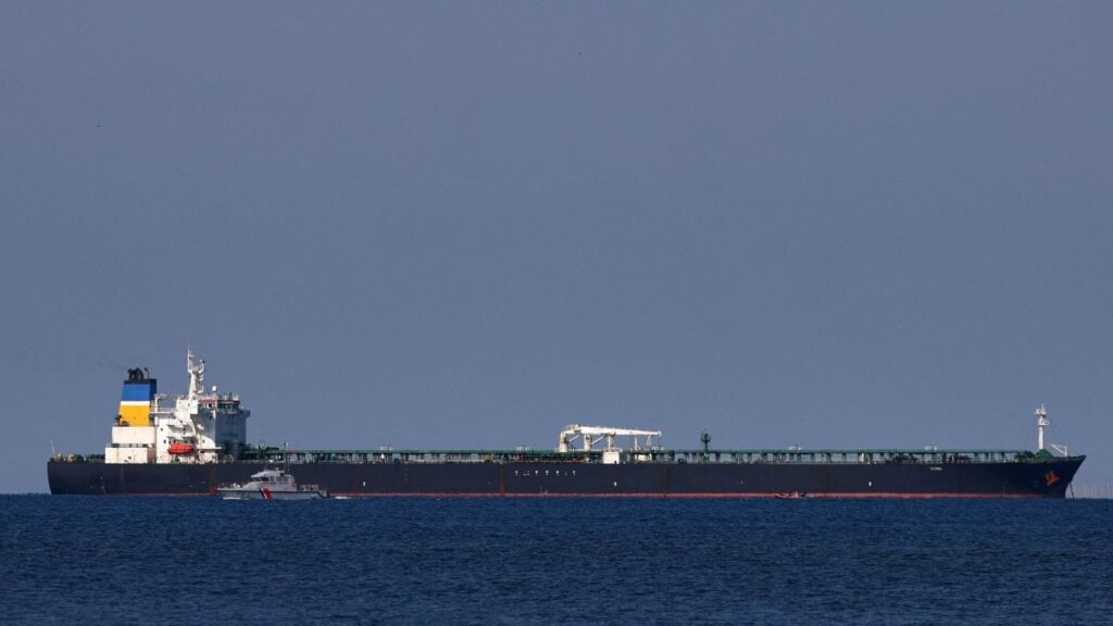 A French Maritime Gendarmerie boat patrols around the Mozambique-flagged oil tanker named Deyna, which France says is part of Russia's shadow fleet, off the port of Marseille-Fos in the Gulf of Fos-sur-Mer, near Martigues, France, March 23, 2026. (Reuters File)