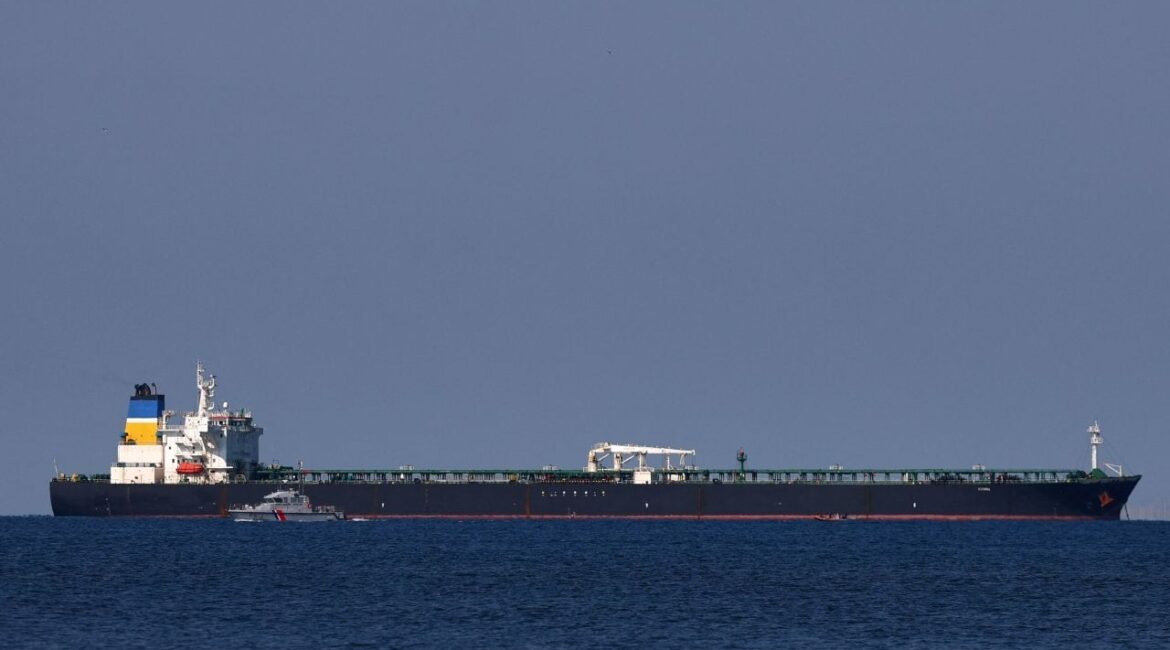 A French Maritime Gendarmerie boat patrols around the Mozambique-flagged oil tanker named Deyna, which France says is part of Russia's shadow fleet, off the port of Marseille-Fos in the Gulf of Fos-sur-Mer, near Martigues, France, March 23, 2026. (Reuters File)