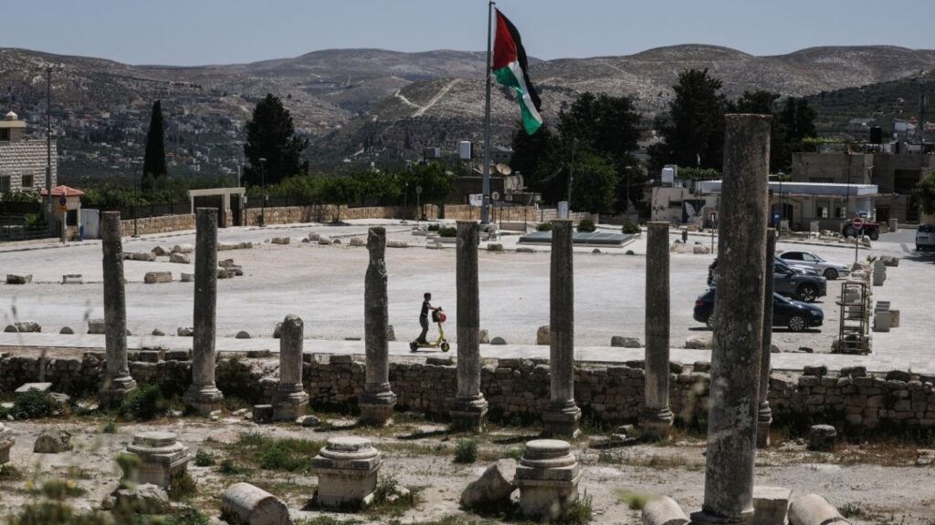 A Palestinian boy rides a scooter through archaeological remains in the ancient village of Sebastia, near Nablus in the Israeli-occupied West Bank, June 4, 2026. REUTERS/Ammar Awad