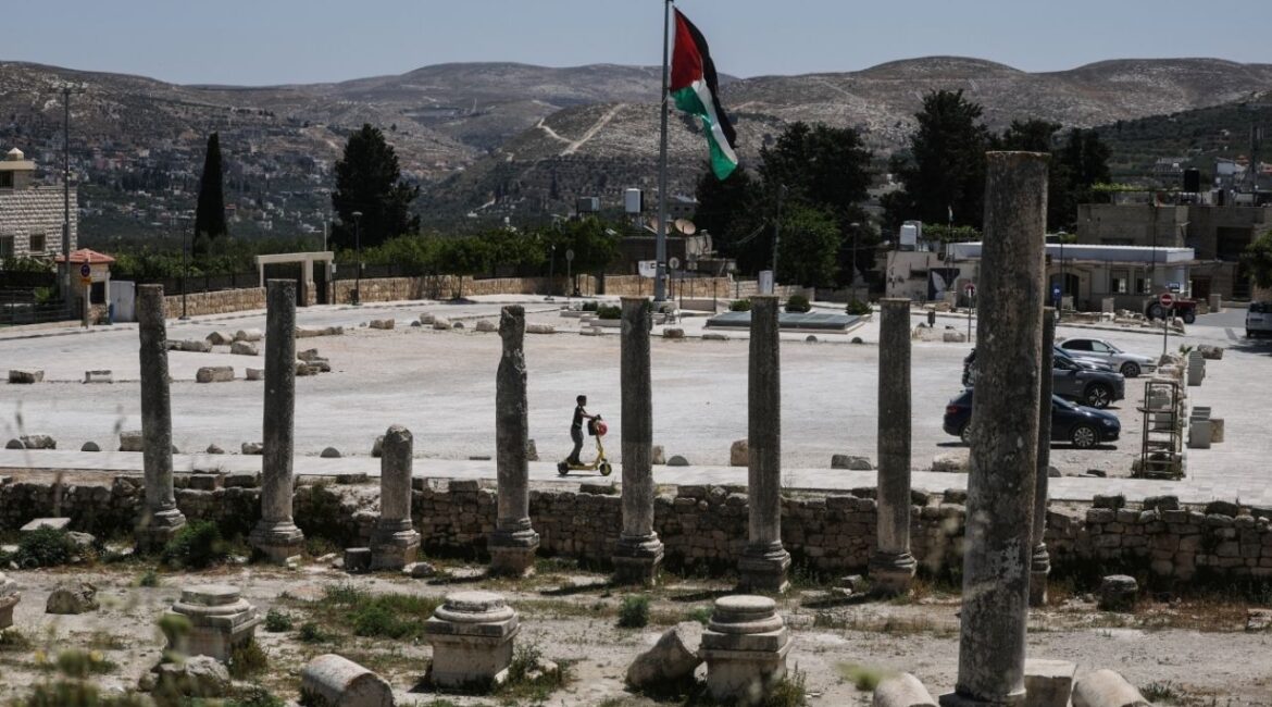 A Palestinian boy rides a scooter through archaeological remains in the ancient village of Sebastia, near Nablus in the Israeli-occupied West Bank, June 4, 2026. REUTERS/Ammar Awad