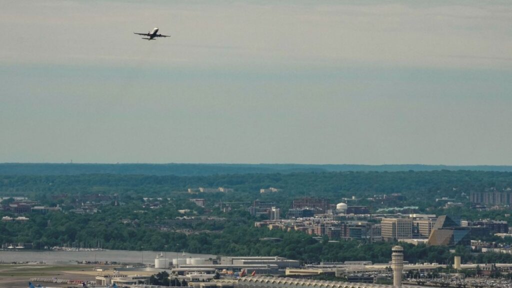 A commercial plane departs Ronald Reagan National Airport, DCA, as seen from the top of the Washington Monument in Washington, D.C., U.S., May 2, 2026. REUTERS/Ken Cedeno