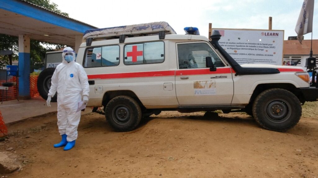 A doctor wearing personal protective equipment (PPE) stands near an ambulance at the Ebola Virus Disease Treatment Center at the Bunia General Reference Hospital, one month after cases were confirmed in Bunia, eastern Democratic Republic of Congo, June 15, 2026. (Reuters File)