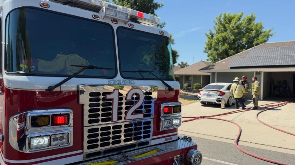 A kitchen fire that spread into the attic of a duplex on N. Emerson Ave. in Fresno on Tuesday displaced three residents and left one firefighter and one occupant treated for smoke inhalation and heat exhaustion, officials said. (Fresno FD)