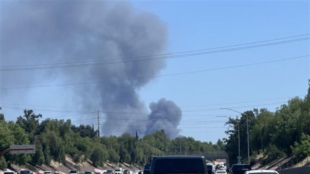 A large warehouse fire in downtown Fresno on Thursday left one building fully engulfed with its roof collapsing as firefighters worked defensively to keep the blaze from spreading to an adjacent evacuated warehouse. (Reader Submitted/Special to GV Wire)