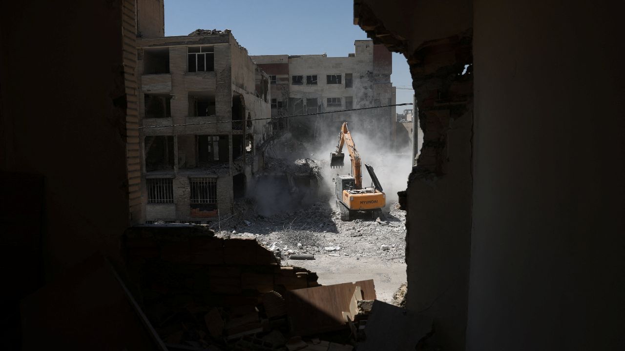 A machine operates near a residential building, which was damaged in a U.S. and Israeli strike in March, in Tehran, Iran June 7, 2026. Majid Asgaripour/WANA (West Asia News Agency) via REUTERS