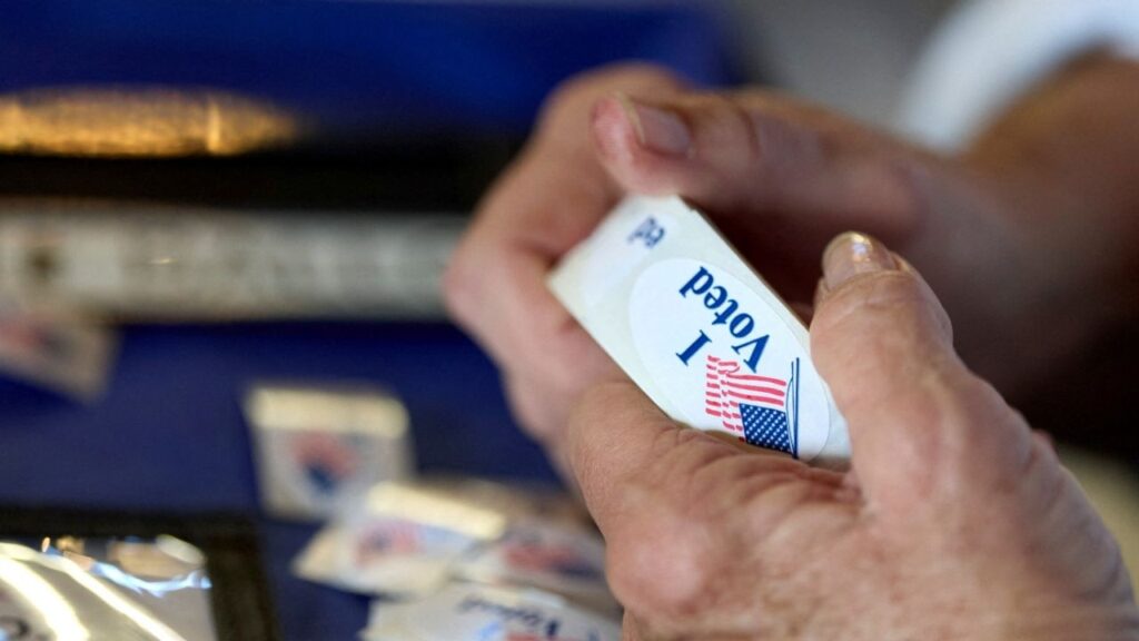 A poll worker holds a roll of 'I voted' stickers at an El Dorado County polling station during California's special election on Proposition 50 in El Dorado Hills, California, U.S., November 4, 2025. (Reuters File)
