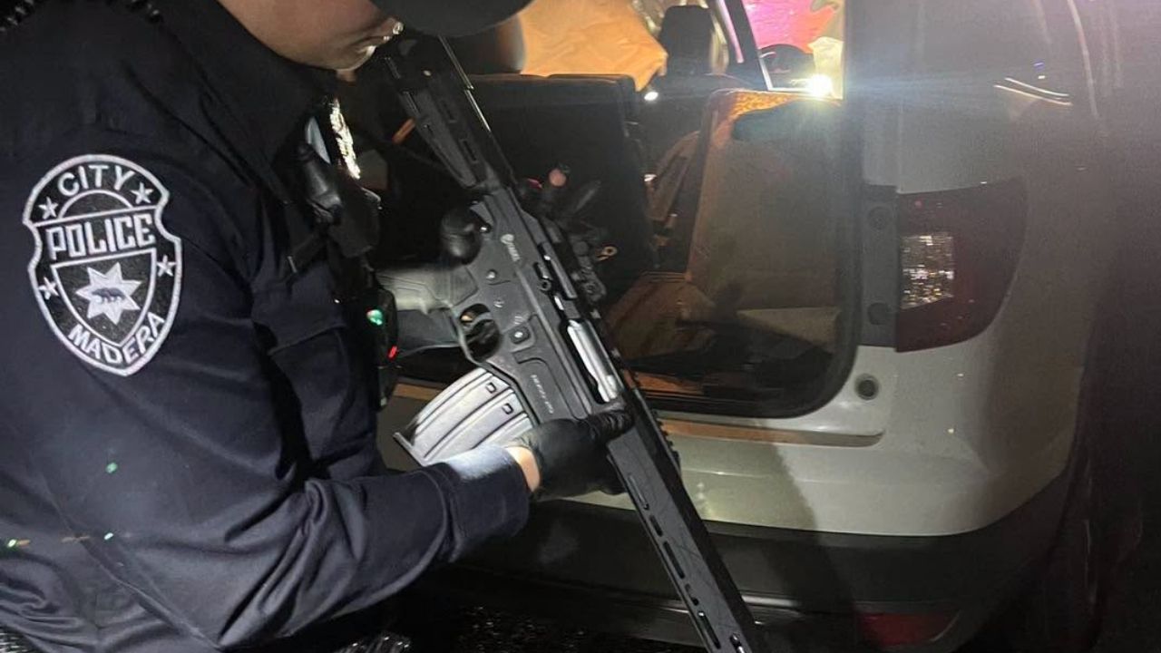 A speeding vehicle on Highway 99 in Madera County led to a solo crash and the arrest of two people, who were found nearby with firearms and booked on multiple weapons-related charges. (Madera PD)
