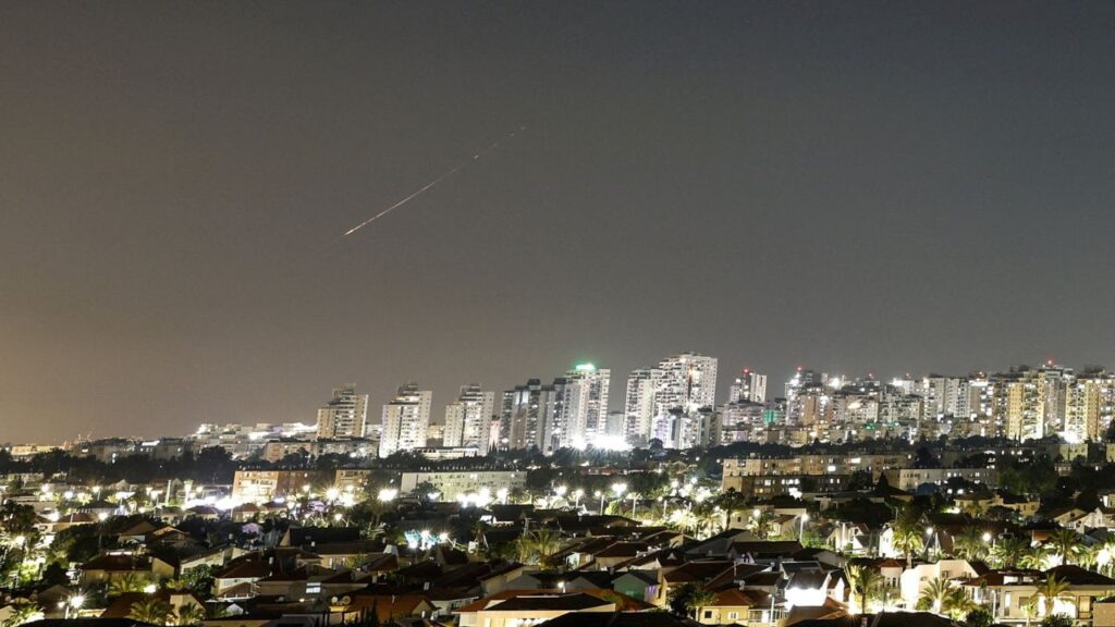 A streak of light illuminates the sky during a missile attack from Iran towards Israel as seen from Ashkelon, Israel, June 7, 2026. REUTERS/Amir Cohen