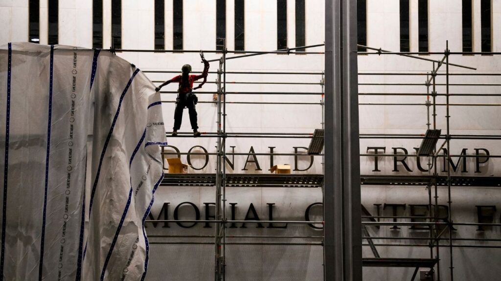 A tarp is attached to scaffolding as workers prepare to remove President Donald Trump’s name from the facade of the John F. Kennedy Center for the Performing Arts in Washington, June 12, 2026. The center was staring down a legal deadline of Friday to remove Trump’s name from the building, based on a federal judge’s order declaring the rebranding unlawful. (Pete Kiehart/The New York Times)