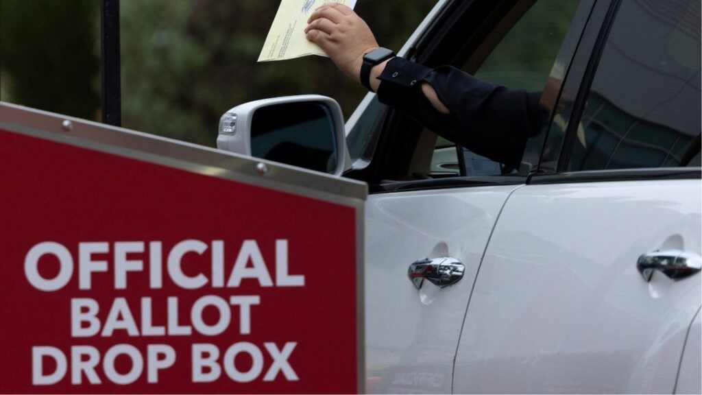 A voter drops off their election ballots at a drive-through ballot drop box outside the registrar of voters' office during the California primary election in San Diego, California, U.S., June 2, 2026. (Reuters/Mike Blake)