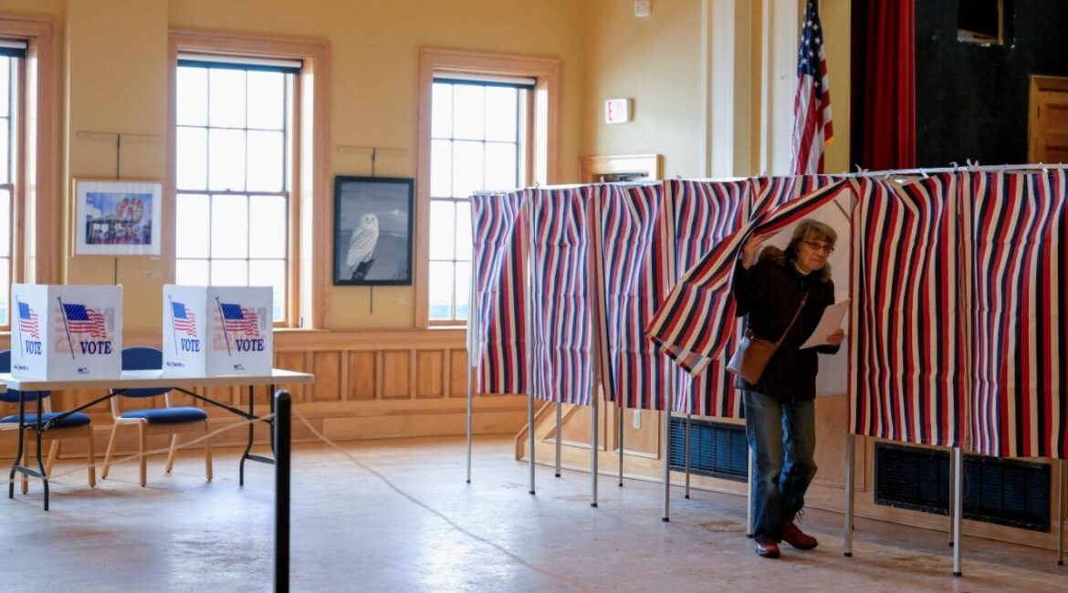 A voter enters a voting booth to fill out a ballot to vote in New Hampshire's first-in-the-nation U.S. presidential primary election at the Medallion Opera House in Gorham, New Hampshire, U.S., January 23, 2024. REUTERS/Faith Ninivaggi