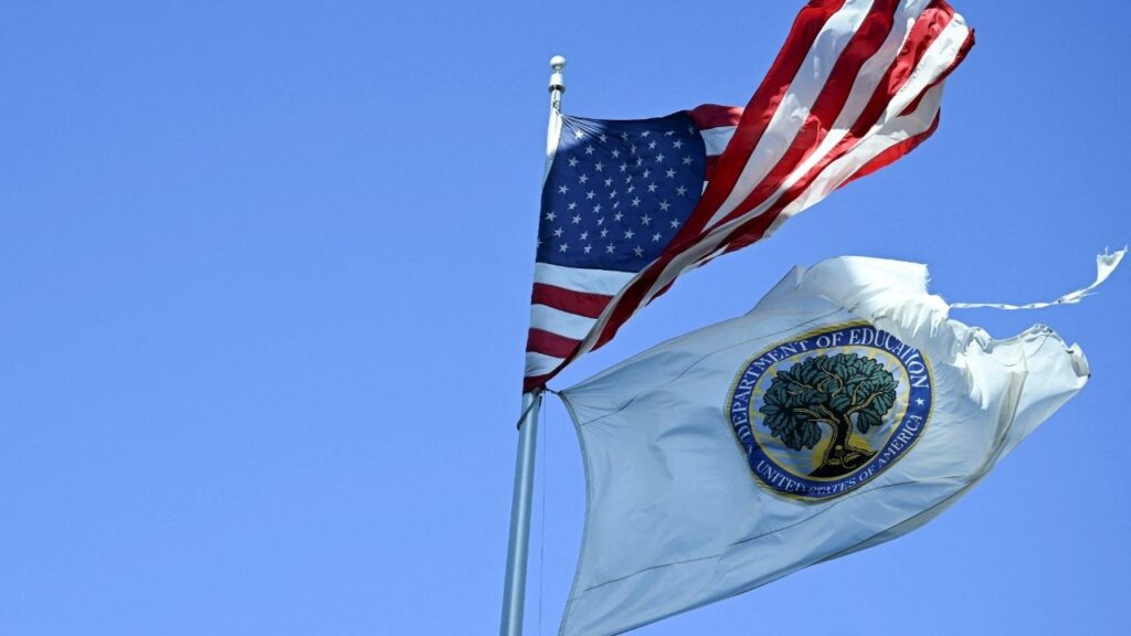 An American flag and U.S. Department of Education flag fly outside the US Department of Education building in Washington, D.C., U.S., February 1, 2025. REUTERS/Annabelle Gordon