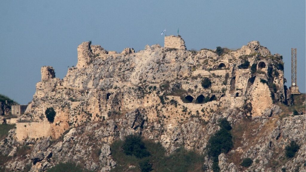 An Israeli flag and a flag of the Golani Brigade fly on Beaufort Castle, as seen from Marjayoun, southern Lebanon, June 1, 2026. (Reuters/Stringer)