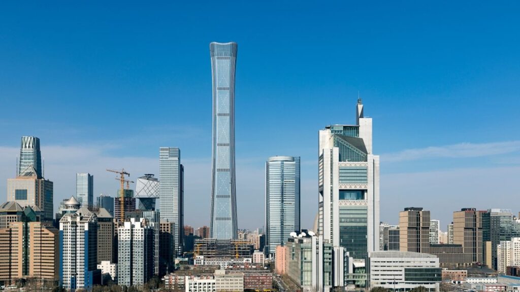 A small aircraft flew into the tallest building in Beijing on Friday, sending huge hunks of debris and plane parts plummeting onto the streets below and prompting crowds to flee. (Shutterstock)