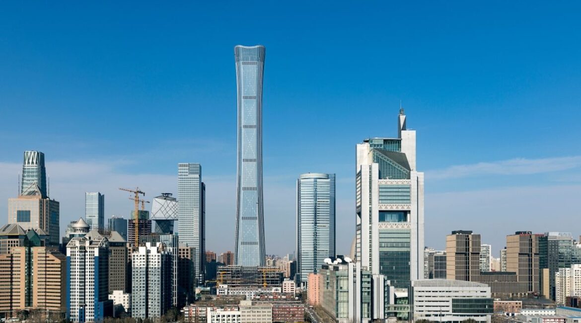 A small aircraft flew into the tallest building in Beijing on Friday, sending huge hunks of debris and plane parts plummeting onto the streets below and prompting crowds to flee. (Shutterstock)