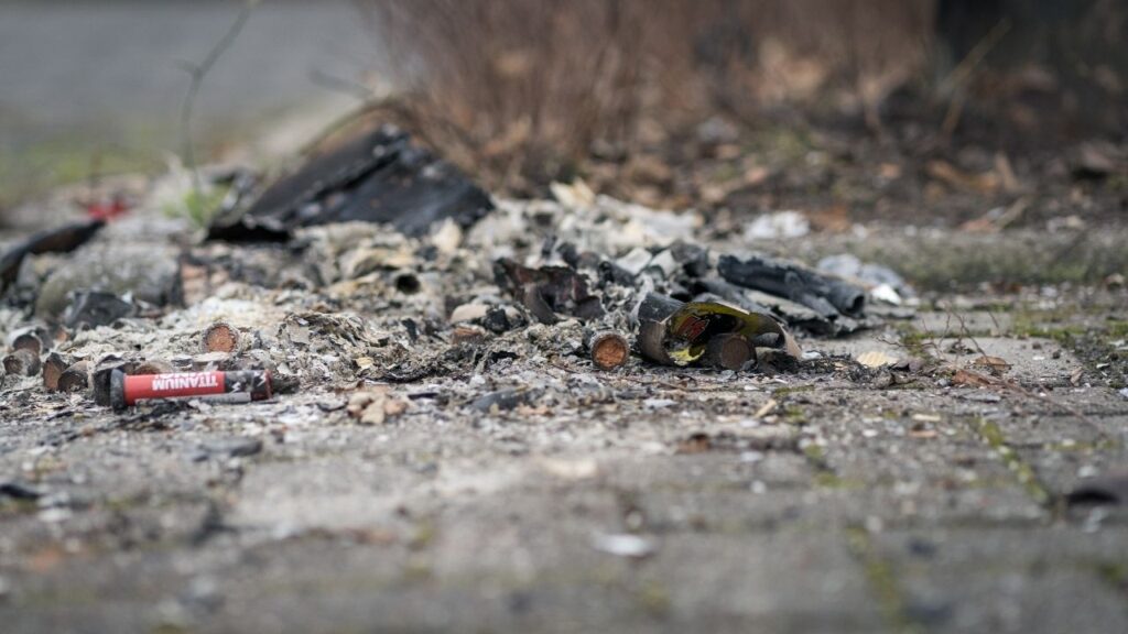 Asset id: 1603150801 BERGSCHENHOEK, THE NETHERLANDS - JANUARI 1, 2020: New Years aftermath. Playgrounds and streets full of empty cardboard firework packages and shells