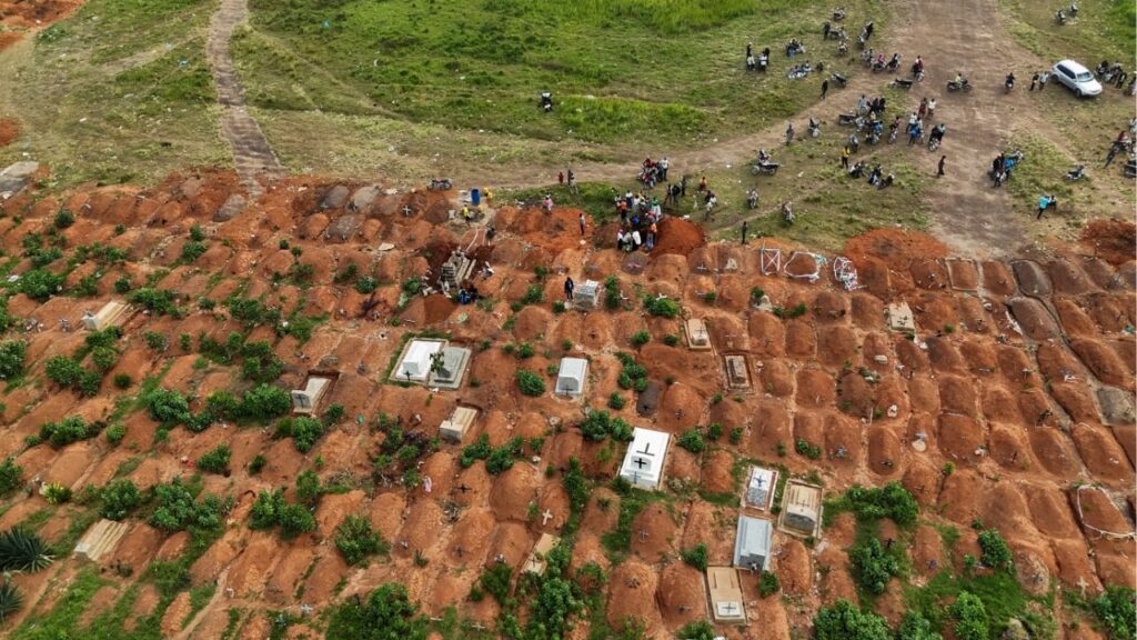 A drone view of displaced people from the Kigonze camp attending the burial of Ebola victims at Nyamurongo Cemetery, one month after an outbreak was declared, in Bunia, eastern Democratic Republic of Congo, June 18, 2026. Reuters/Gradel Muyisa Mumbere