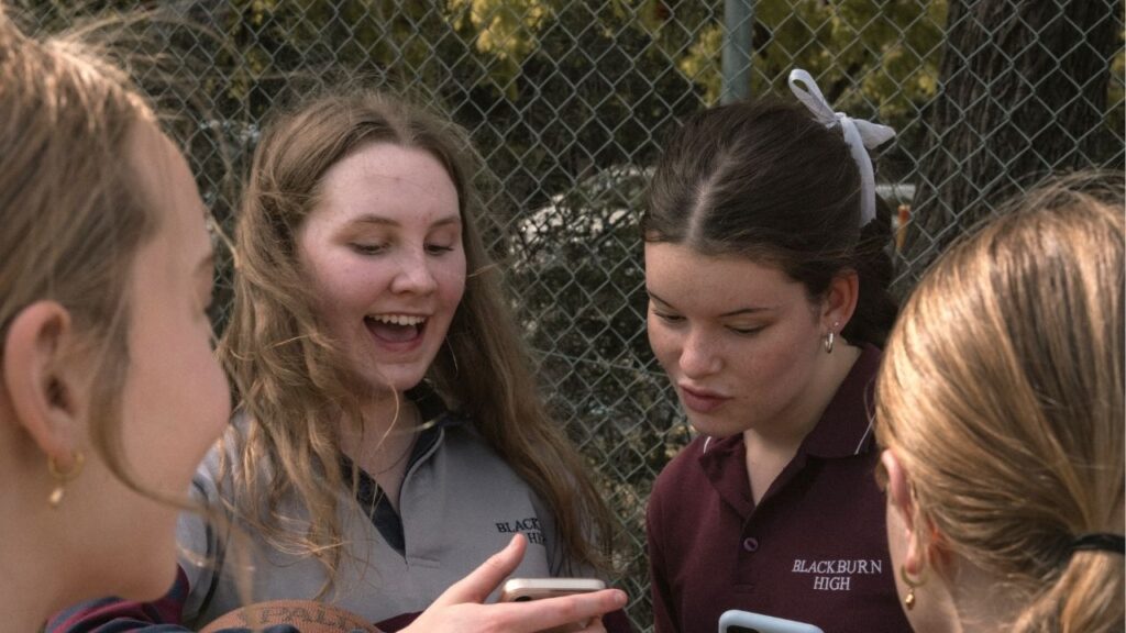 Friends gather to watch a TikTok video in Melbourne, Australia, Nov. 13, 2025. The Australian government said on Saturday that it would take steps to strengthen its law banning anyone under 16 from major social media platforms, in an acknowledgment of the limited efficacy of the world’s first attempt to prohibit children’s use of the services. (Matthew Abbott /The New York Times)