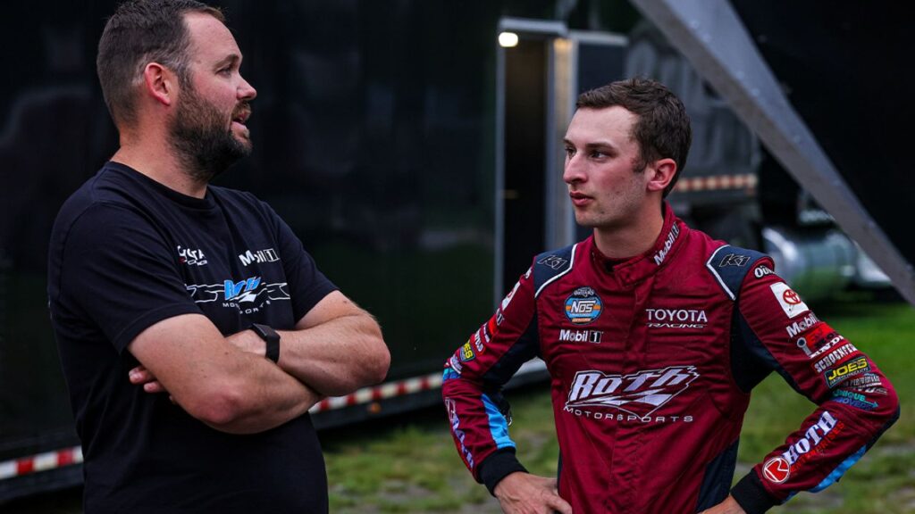 Image of sprint car crew chief Dylan Buswell and driver Buddy Kofoid across from each other talking