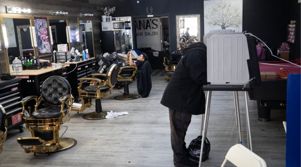 Kevin Stull, right, fills out his ballot as Bryan Diaz waits to give a haircut at Ana’s Hair Salon, which was acting as a polling place, on primary election day in San Francisco, on June 2, 2026. Voters rejected more local taxes than usual in the June election, a sign that they are feeling the pinch from rising costs. (Minh Connors/The New York Times)