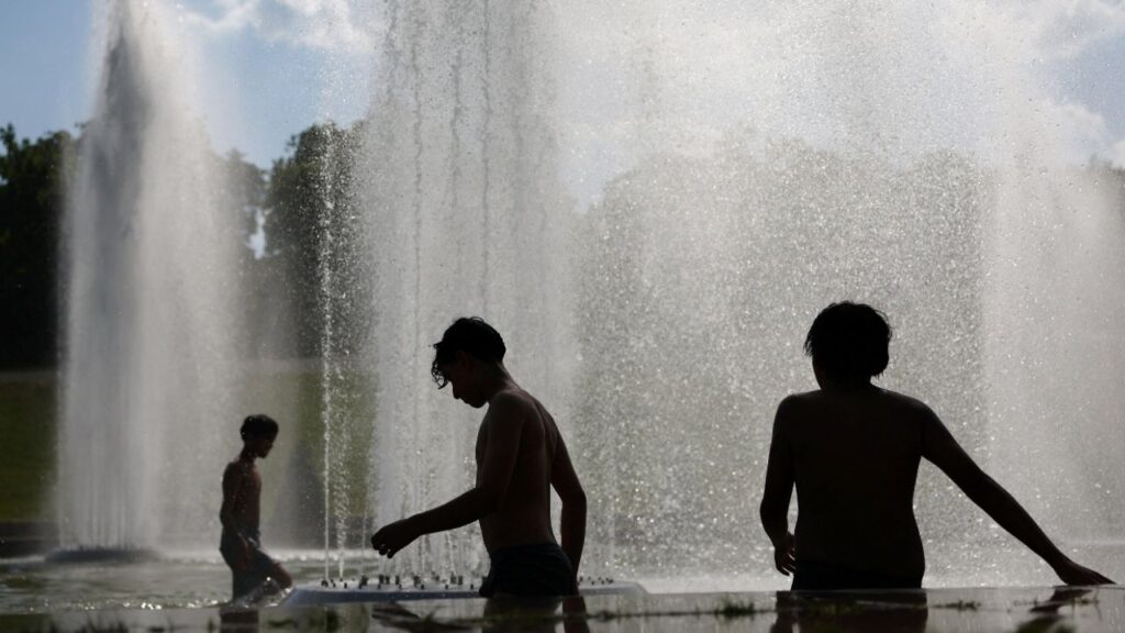 Children cool off in the Trocadero Fountain next to the Eiffel Tower in Paris as temperatures rise during a heatwave affecting a large part of France, June 22, 2026. (Reuters/Abdul Saboor)