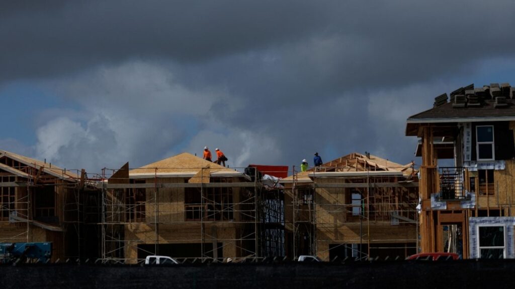 Construction workers use wood and lumber to build residential homes in Irvine, California, U.S., March 28, 2025. (Reuters/Mike Blake)