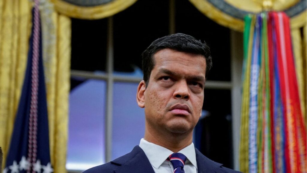 Sriram Krishnan, Senior White House Policy Advisor on Artificial Intelligence, listens prior to U.S. President Donald Trump (not pictured) signing an executive order on AI in the Oval Office at the White House in Washington, D.C., U.S. December 11, 2025. Reuters/Al Drago