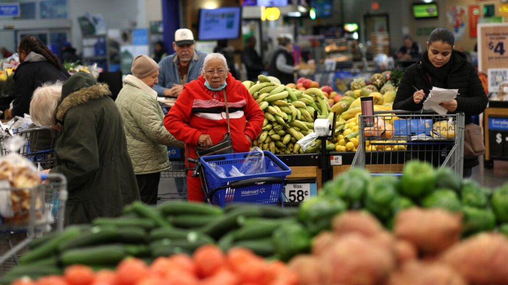 Customers shop for groceries at a Walmart Supercenter retail store in North Bergen, New Jersey, U.S., November 21, 2025. (Reuters/Mike Segar)