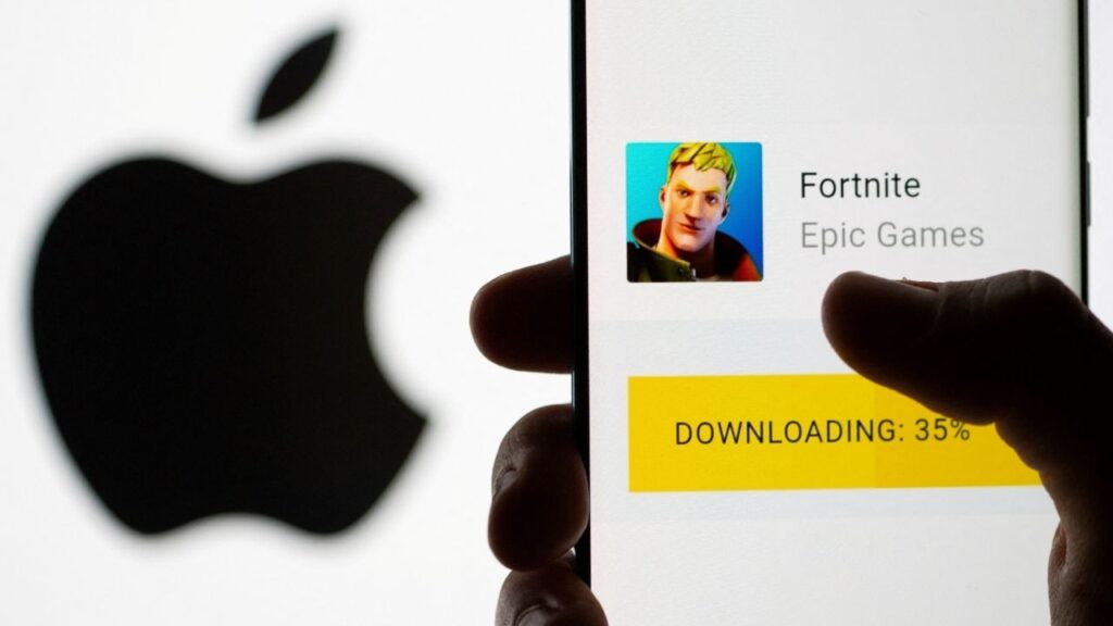Fortnite game download on Android operating system is seen in front of Apple logo in this illustration taken, May 2, 2021. (Reuters File)