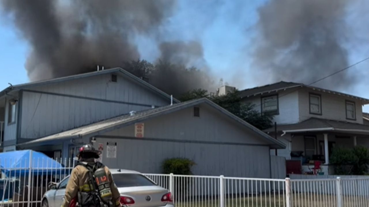 Fresno firefighters extinguished a garage fire on N. Calaveras St. that spread to nearby trees and briefly threatened homes and an apartment complex, with no injuries reported. (Fresno FD)