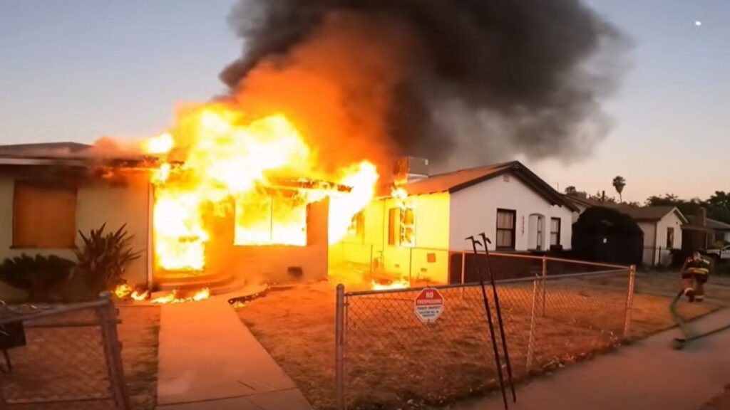 Fresno firefighters say an arson fire destroyed a vacant home under construction on S. Lily Ave. late Wednesday night, damaging a nearby residence and displacing two people. (Fresno FD)