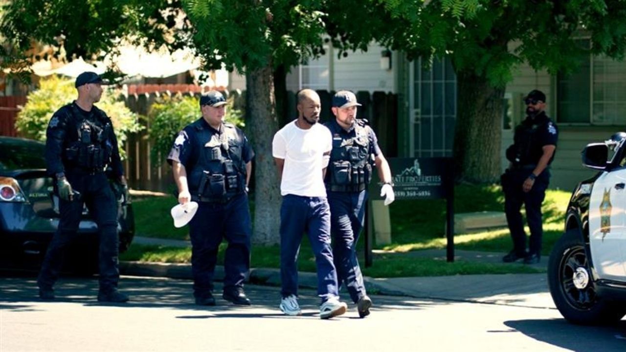 Fresno police arrested a domestic violence suspect Friday, June 19, 2026, during a warrant operation at Thorne and Herndon avenues that included a large police presence, a drone and a K-9 unit, authorities said. (GV Wire/Eric Martinez. Video/Eric Martinez & Jahziel Tello)